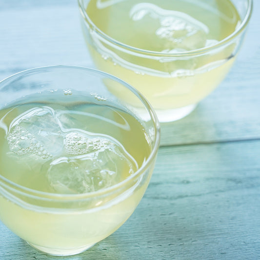 Refreshing NakamuraTokichi Cold Brew Sencha served over ice in clear glass cups, highlight the light green colow and crisp taste of Uji green tea.