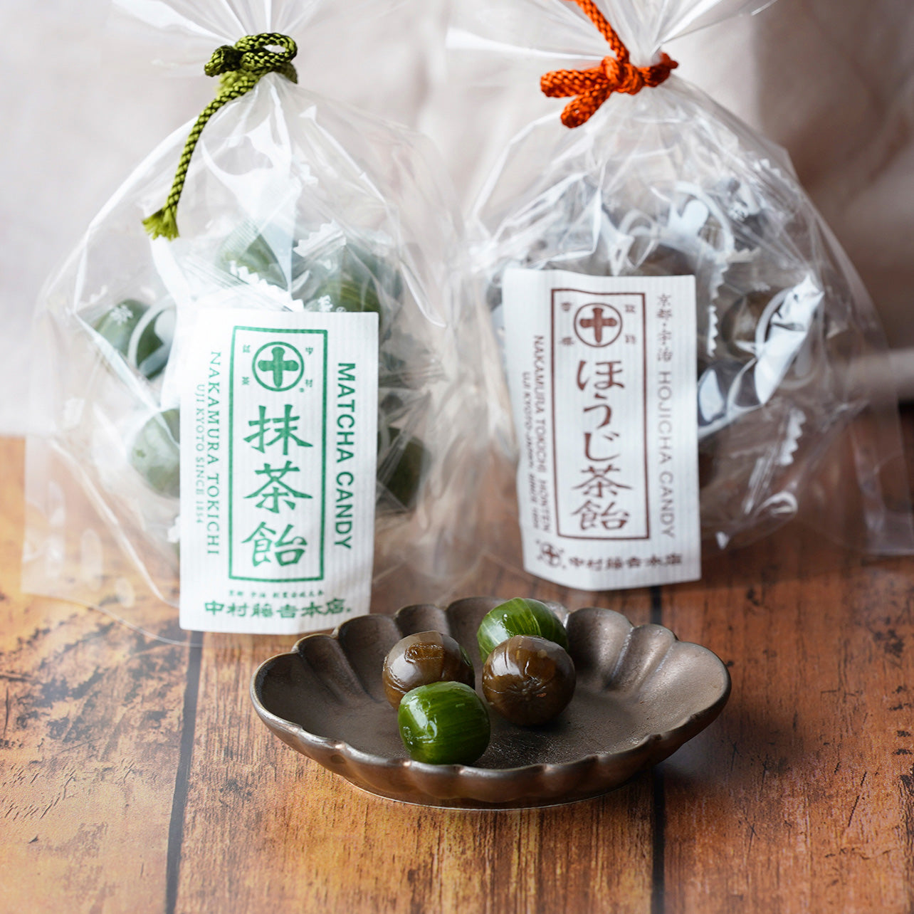 Nakamura Tokichi Uji Matcha and Hojicha Hard Candies (Ame) Displayed on Brown Plate with Product Packaging